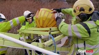 Statnett monterer flymarkører med robotteknologi