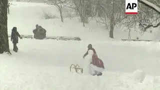 Children enjoy the snow in New York's Central Park