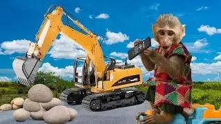 Monkey Baby Jerry using the Big Truck to move stones