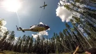 Slinging a broken helicopter out of the woods