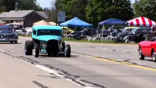 Light blue '50's car and antique car lead this pack of classic autos in Cruisin' Hines