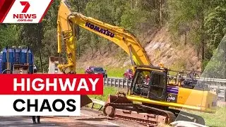 Truck smashes into Bruce Highway overpass | 7NEWS