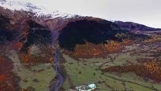 Majestic mountains with snowy peak near Mestia filmed by drone at autumn day