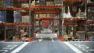 Warehouse with cardboard boxes inside on pallets racks, logistic center.
