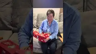 Mom opening her Gift from Renee Kidd