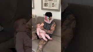 Dad outsmarts baby while feeding
