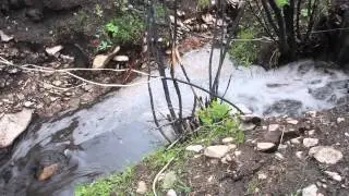 East Peak Fire, creek running with soot
