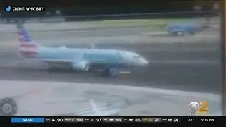 Plane collides with towing vehicle at LaGuardia Airport