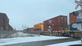 Awesome Canadian CN freight train accelerating through level crossing!