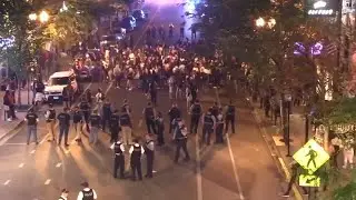 2 arrested after hundreds seen on cars, blocking traffic on North Side of Chicago