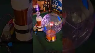 Solid State Tesla Coil remotely powering a Slave Coil with plasma globe