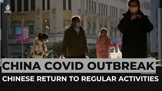 Chinese return to regular activities amid COVID surge