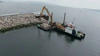 WM PLANT HIRE CAT 374 D LONG REACH TOPPING UP ROCK ARMOUR PROTECTION AT DUNOON FERRY TERMINAL