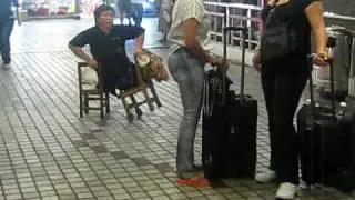 Martyna in China. Homeless guy without legs walking on chairs. Chairman!