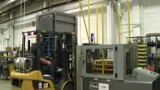 Load Transfer Station with Pallet Dispenser Transferring Wood to Chep Pallet