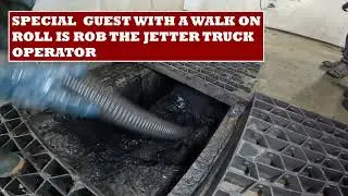 Vacuum truck sucking sludge.