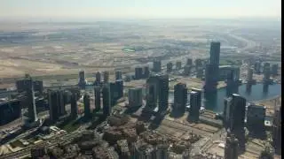 Aerial View of Skyscrapers, Highway, and Desert in Dubai