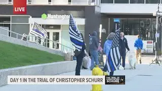 Supporters of Christopher Schurr fly 'Blue Lives Matter' flags in front of courthouse