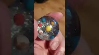 epoxy resin solar system sphere with moon and pluto