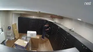 Ron putting package in Locker 9 May 15 2017 at 1014 AM
