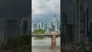 Aerial hyperlapse of Frankfurt skyline with Main River and Ignatz Bubis Bridge. Frankfurt, Germany