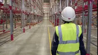 Shot of Female Industrial Worker in the Hard Hat Walking Through Heavy Industry Manufacturing