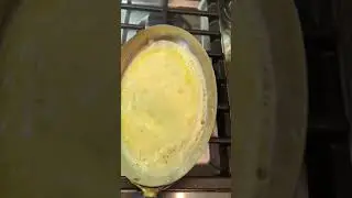 Slow scramble on vintage tin-lined copper skillet using the correct amount of butter, 15g per 2 eggs