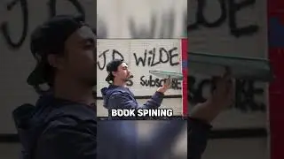 I SPIN THE BOOK ON MY HIDDEN FINGER