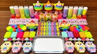 Slime mixing rainbow palette with clear glossy swirls and pops #69