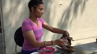 Young woman, shoe repair apprentice, works on a boot
