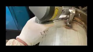 Large bore hose being laser cleaned