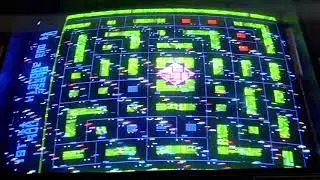 Beth and Amanda playing Tron (cocktail) at an arcade