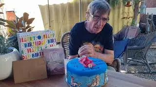 Eric cutting his cake