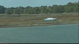 What's the story behind the little blue boat sitting on the marsh in Bluffton?