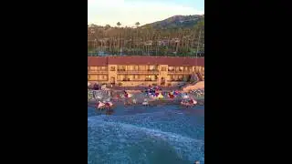 Drone video at Sunset at the Private La Jolla Beach and Tennis Club in La Jolla, California.