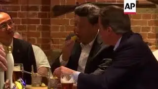 China's President Xi Jinping and Prime Minister David Cameron in a pub