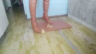 high brown boots destroy an apple