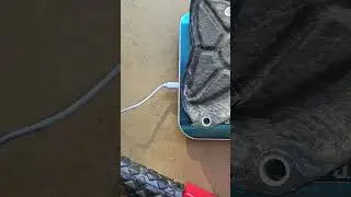 Carbon fibre sprocket cover weight vs stock plastic = more weight gone!