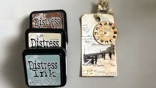 Mixed media art tag using collage, and distress inks.