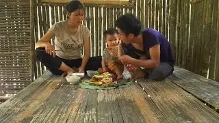 The whole family lives freely in the forest, farming and harvesting rice - green forest life.
