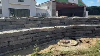 Massive natural outcropping retaining wall installation at a private Airstrip Hanger!  