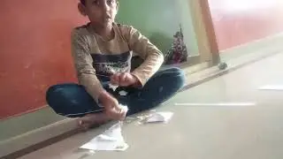 My son create a paper shoot