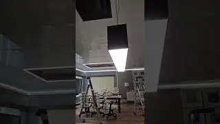 glossy stretch ceiling and light lines in an office space