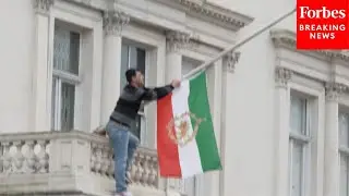 Protester Tears Down Flag From London's Iranian Embassy In Support Of Ongoing Protests In Country