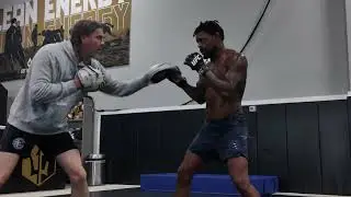 Jason Strout holding pads for Michael Johnson