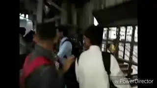 Indian speeding train splashes water in Mumbai