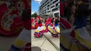 Sentir Venezuela parade down the street during Salsa on St. Clair