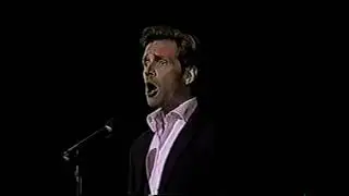Malcolm Gets singing The Caveman Song in 2001