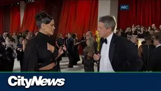 Hugh Grant's awkward red carpet interview with Ashley Graham