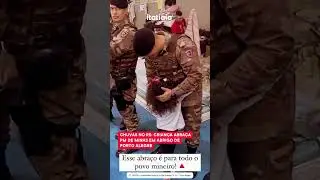CHUVAS NO RS: CRIAN&Ccedil;A ABRA&Ccedil;A PM DE MINAS EM ABRIGO DE PORTO ALEGRE